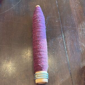 Vintage wood spool with burgundy thread